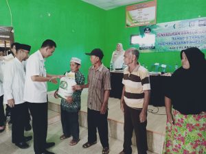 Pj.Bupati Pringsewu Serahkan Bantuan Pangan Beras
