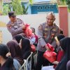 Baru Dilantik, Kapolres Pringsewu Langsung Blusukan dan Berbagi Sembako Dan Bendera